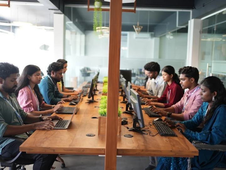 Students working at the long shared desks